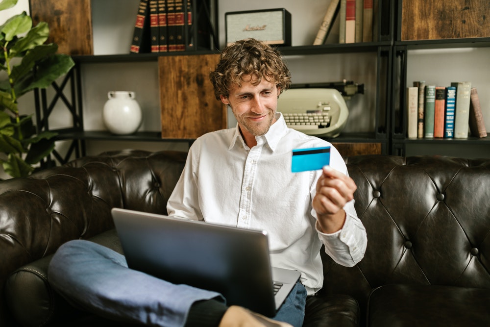Image of man with credit card