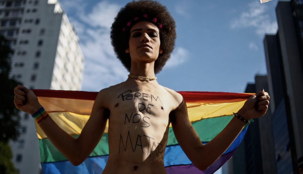 Protestor demonstrating against trans murder rate in Brazil