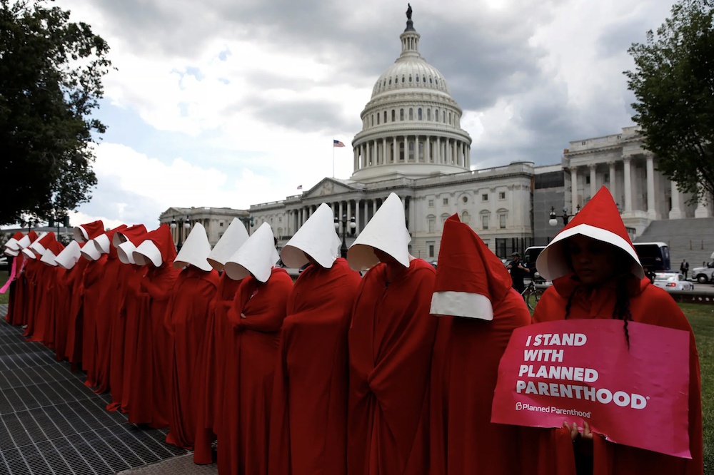Protestors dressed as characters from The Handmaid's Tale demostrate for the right to an abortion