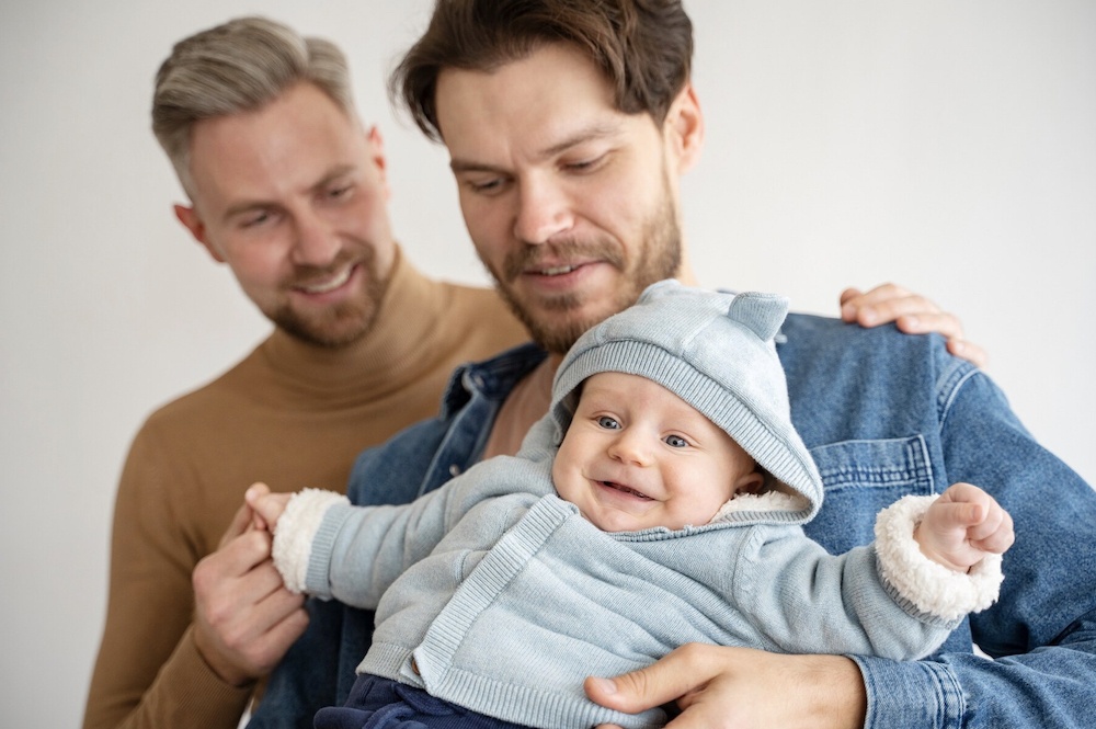 Two dads with baby born via surrogacy